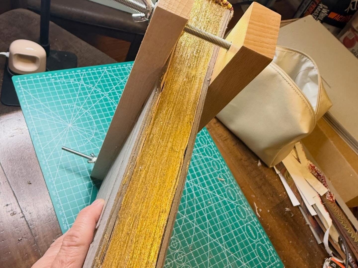 24k gold-gilded fore-edge on a hand-bound magical record