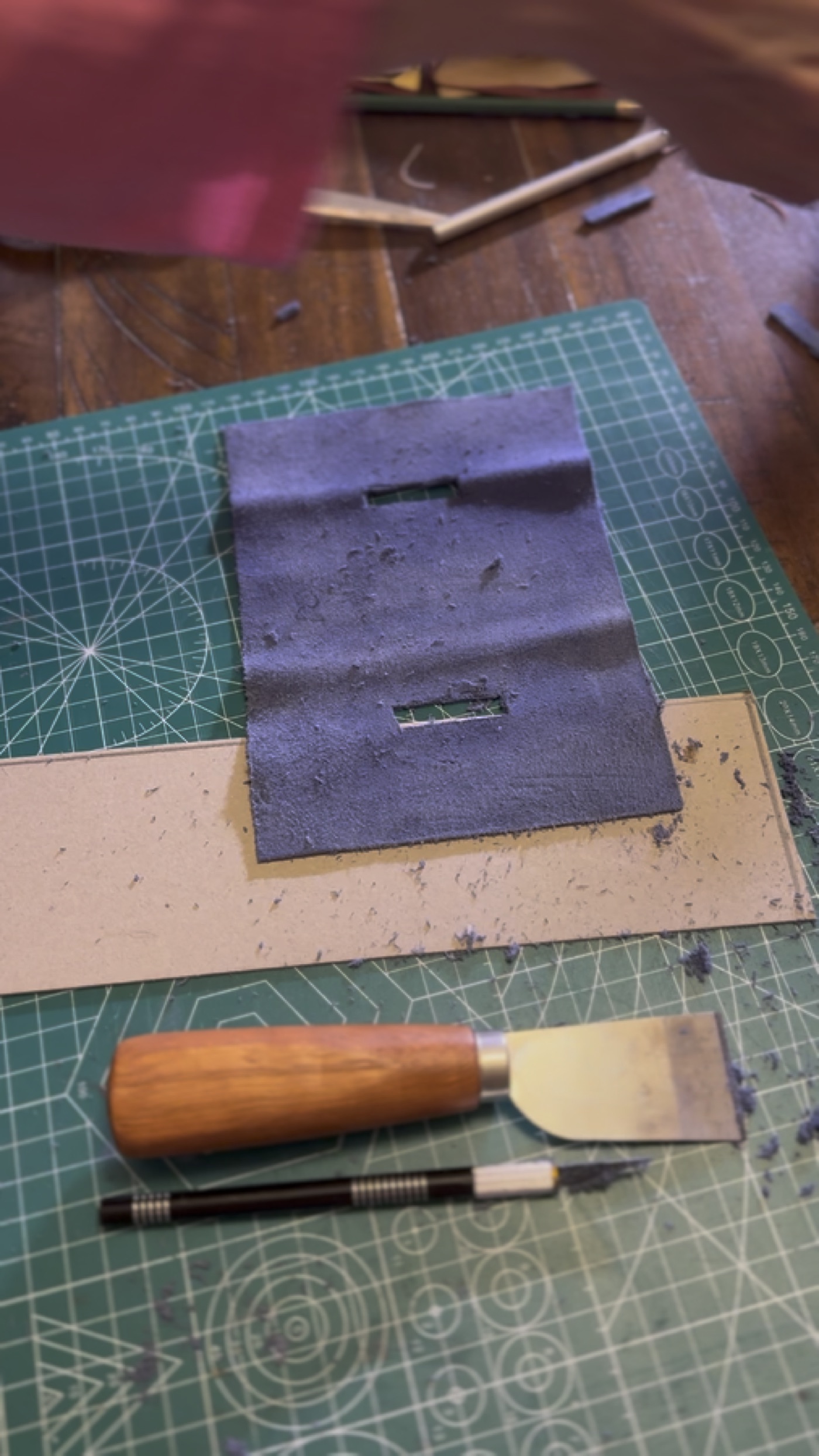 Leather preparation and tooling work for a hand-bound magical record