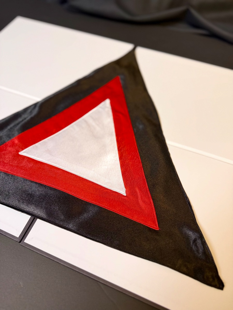 Martinist Triangle Altar Cloth, angled detail of the red border and satin field