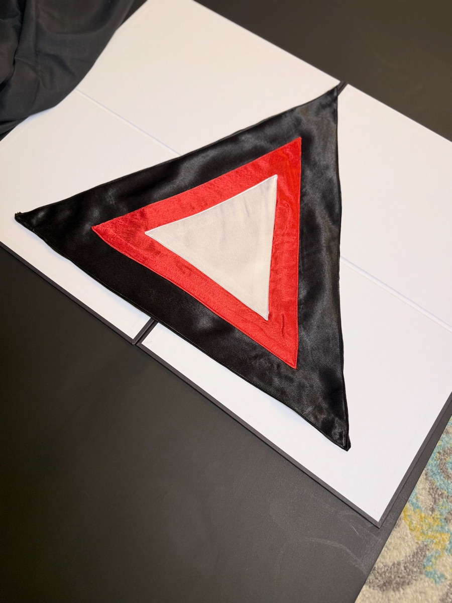 Martinist Triangle Altar Cloth, angled view of the black satin and red border